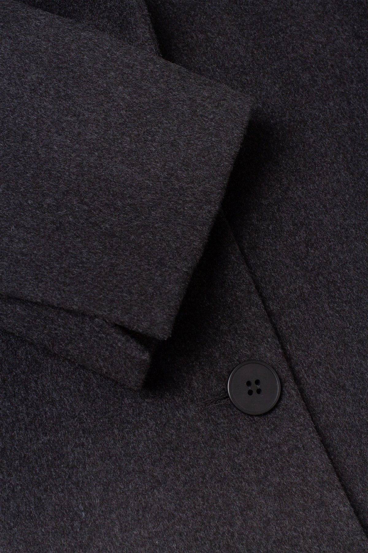 Coat with pleat at the back