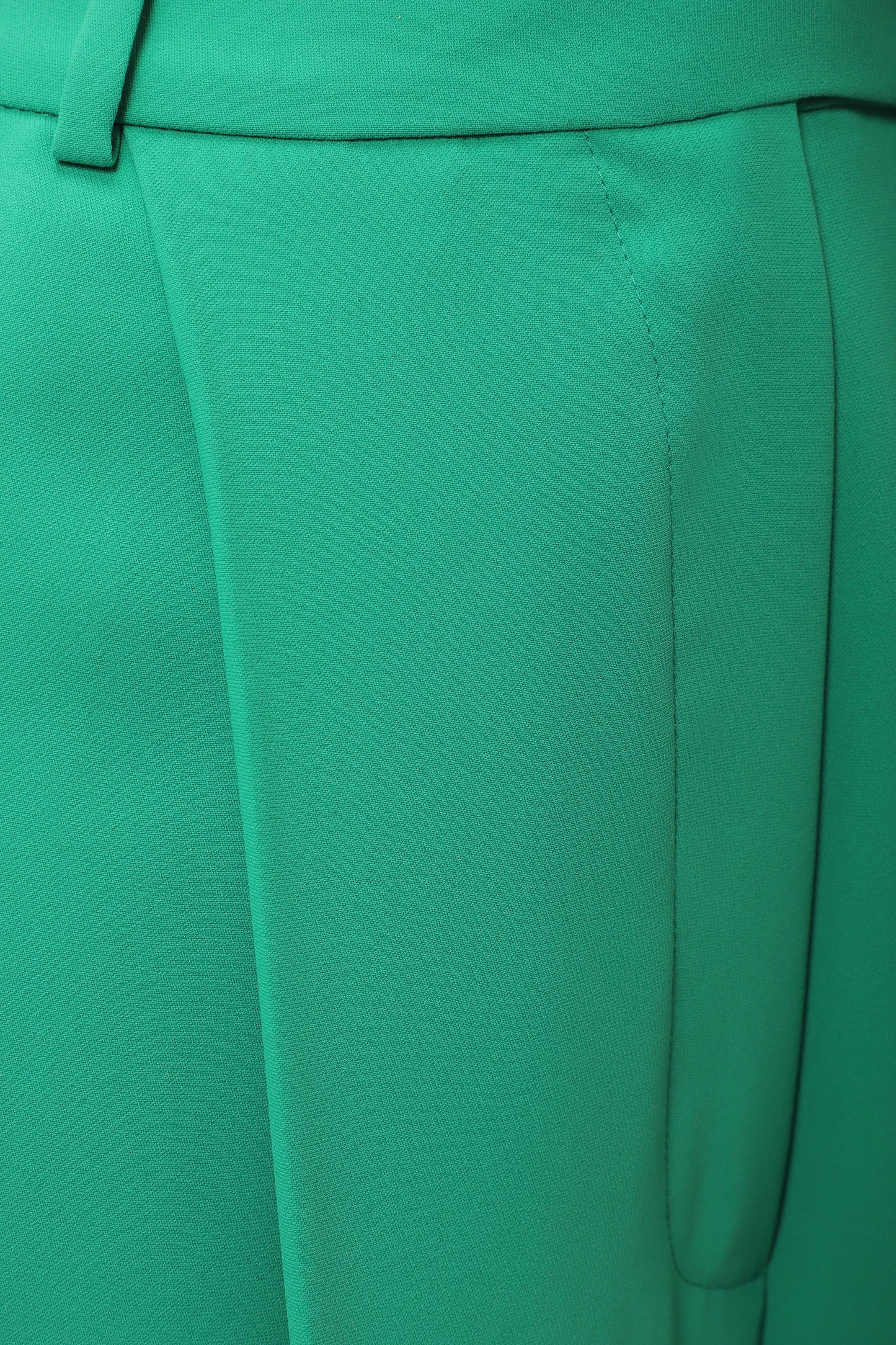 Pleated trousers in green silk